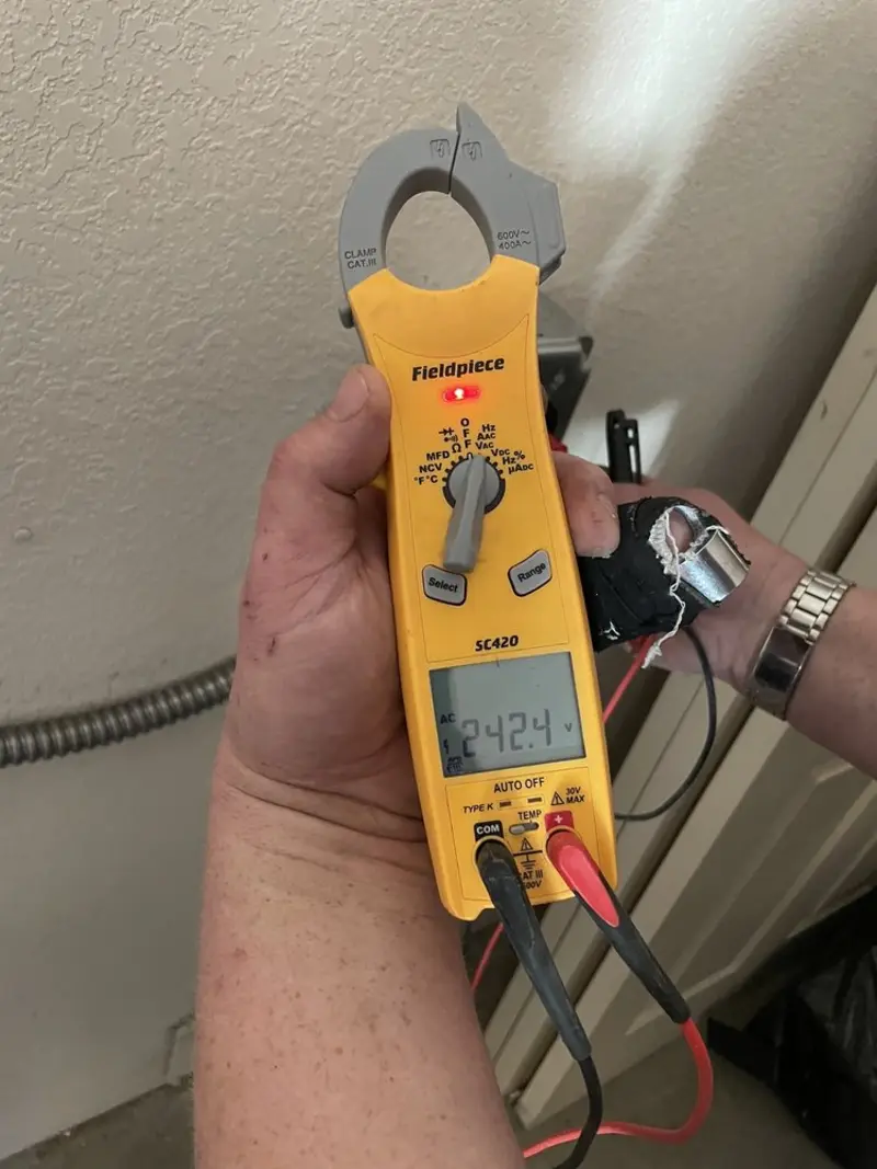 Voltage testing with clamp meter during Whole House Surge Protector in Floris